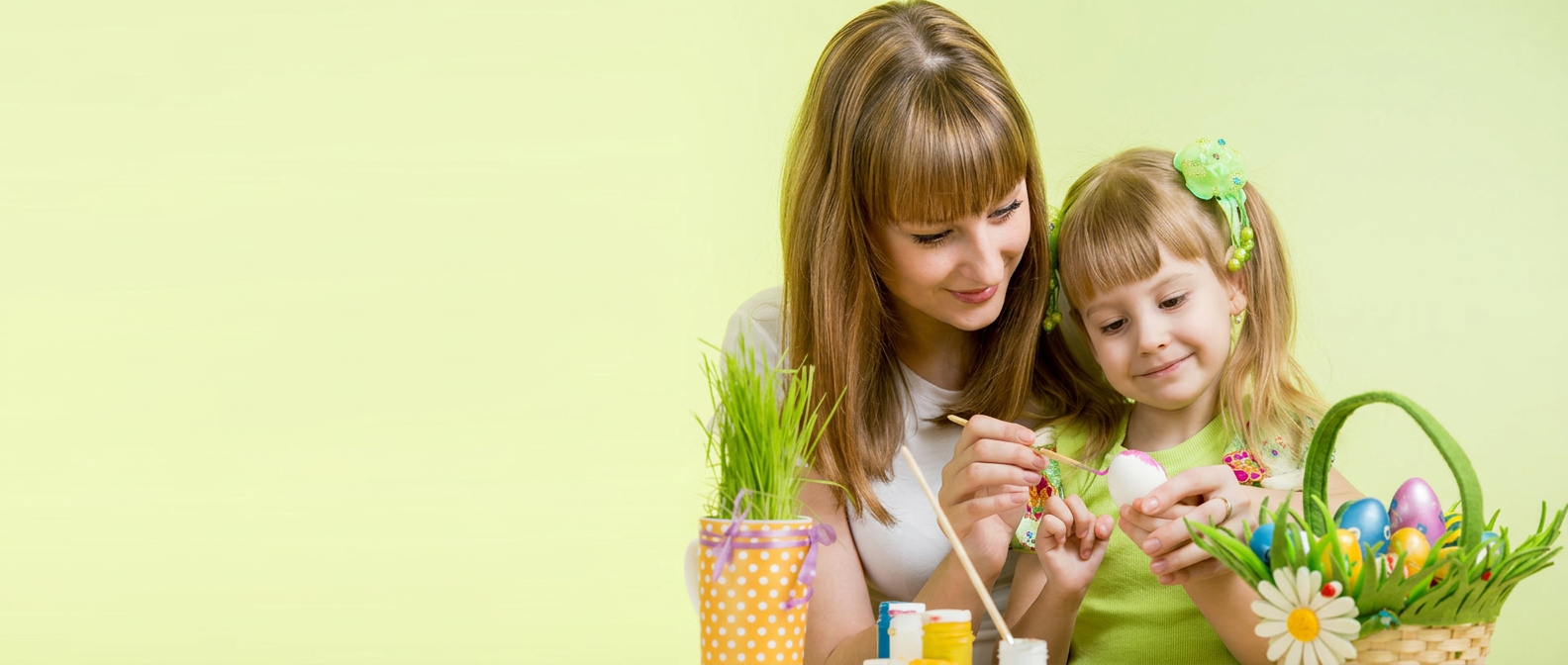 An educator and child enjoying a creative activity together